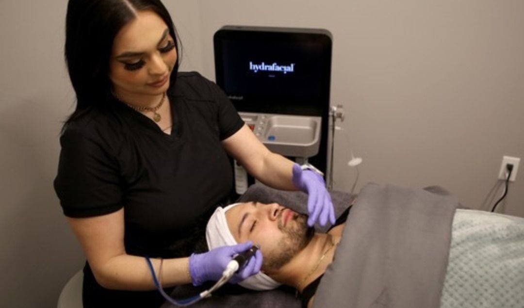 Crown Point HydraFacial patient model receiving treatment