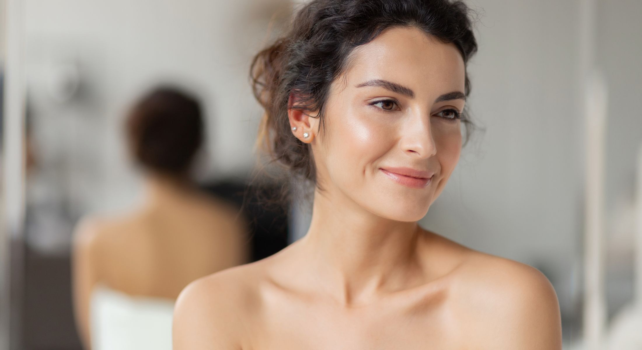 Crown Point Photofacial model wearing a towel smiling